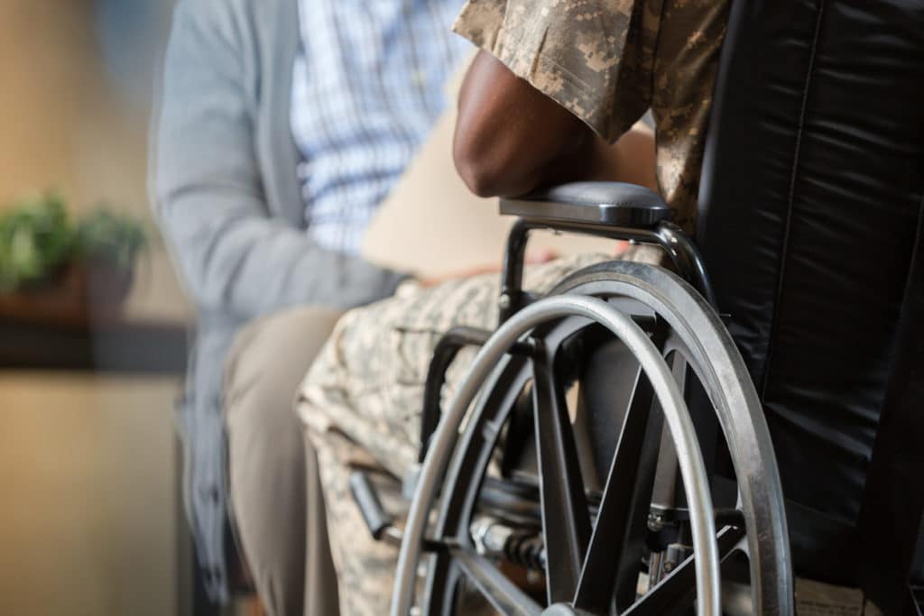 Injured veteran talks with psychiatrist