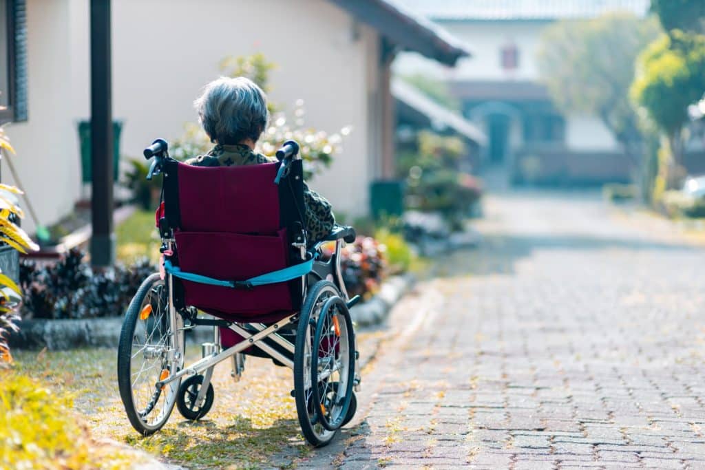 senior sitting on a wheel chair