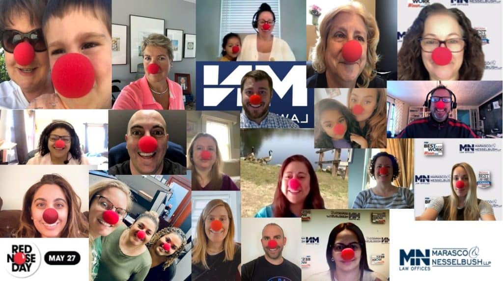 a group of Marasco & Nesselbush employees wear red noses in support of Red Nose Day