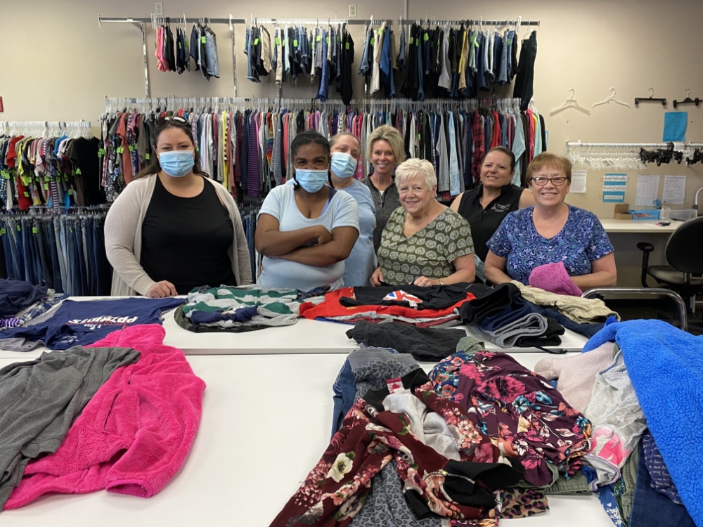 a group of women at charity drive for clothing for kids