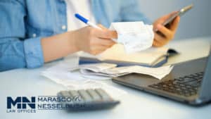 a person looking through receipts
