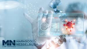 A doctor holding up a digital screen in their hands
