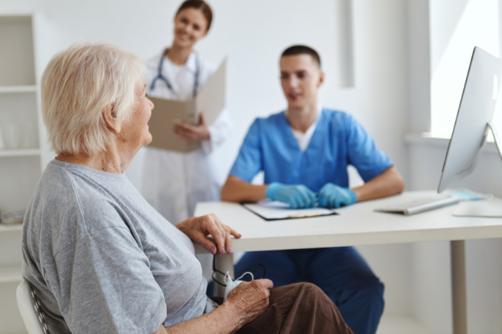 a woman talking with doctors