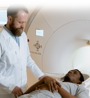 a doctor putting a patient in the MRI