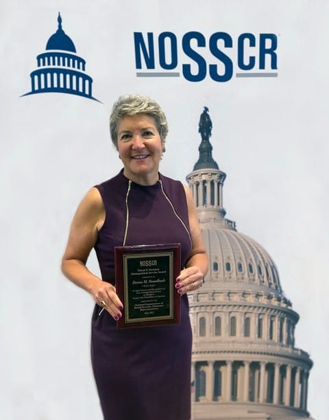 Donna Nesselbush accepting an award