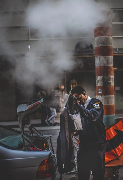 a person taking clothes out of a car