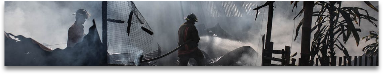 firefighters putting out a building fire