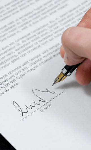 a person signing a document