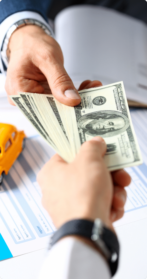 a person handing money to another person