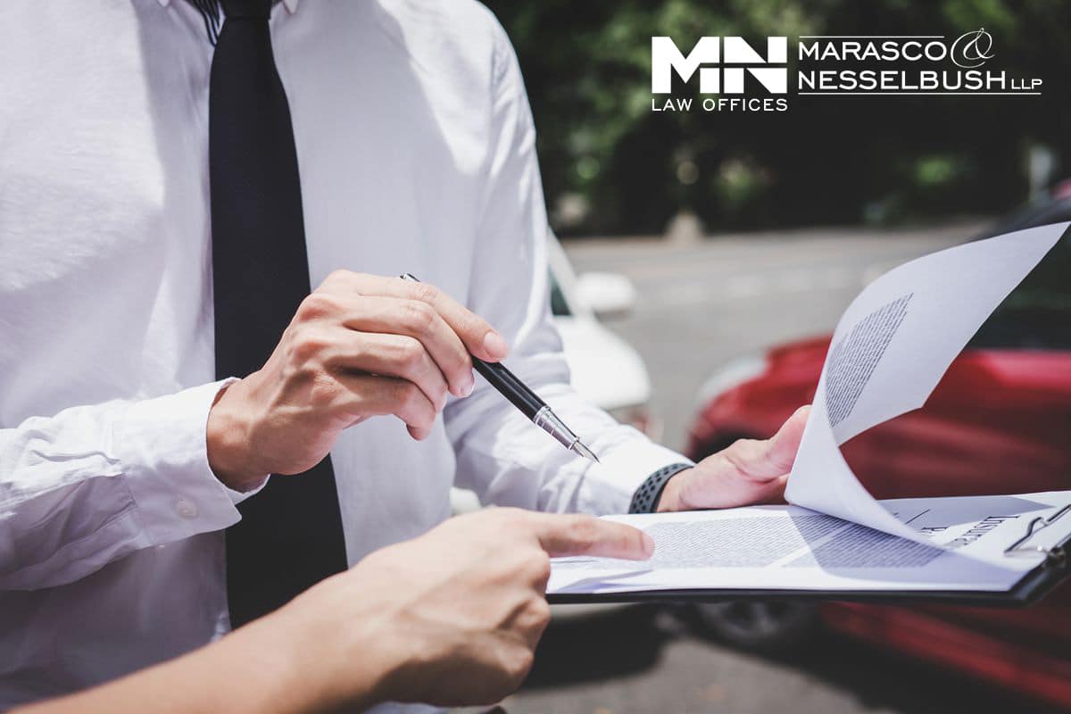 two people reviewing insurance documents