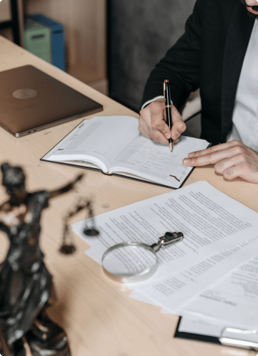 a lawyer writing in a notebook