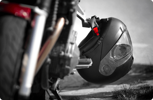 a helmet next to a motorcycle
