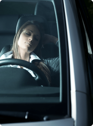 a lady sleeping in a car