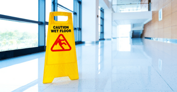 a wet floor sign in an office building