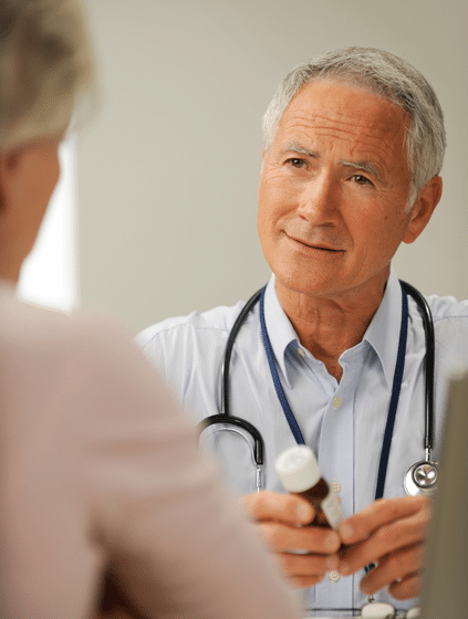 a woman talking to a doctor in rhode island