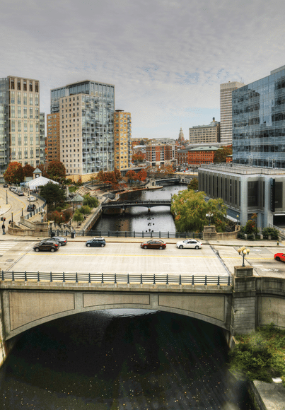 cars crossing a bridge in downtown providence