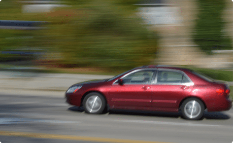 a car speeding on a road