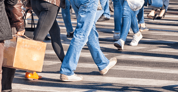 people walking in a crosswalk