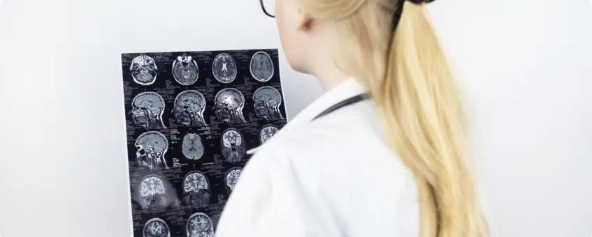 a nurse studying an x-ray