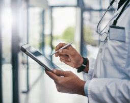 a doctor looking at a patients chart