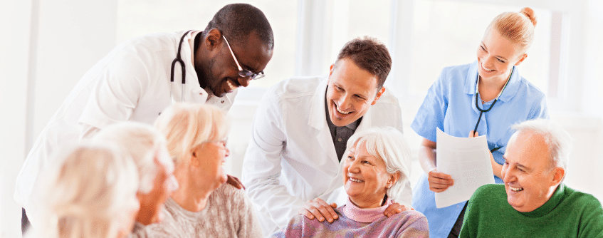 a group of people being helped by a doctor