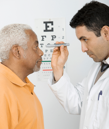 a doctor examining a patients eyes