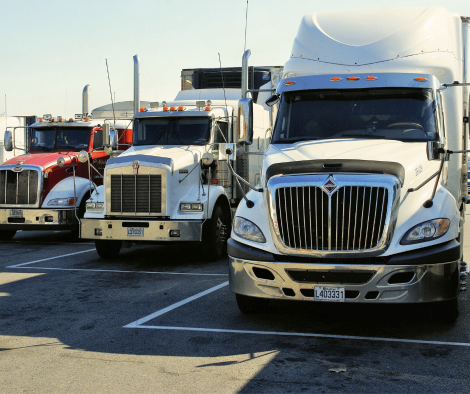 semi trucks in a parking lot