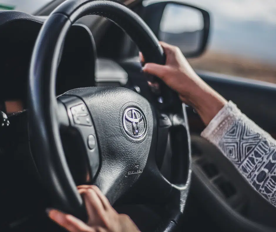 a woman driving a car in rhode island