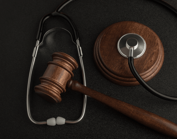 a stethoscope and a wooden gavel