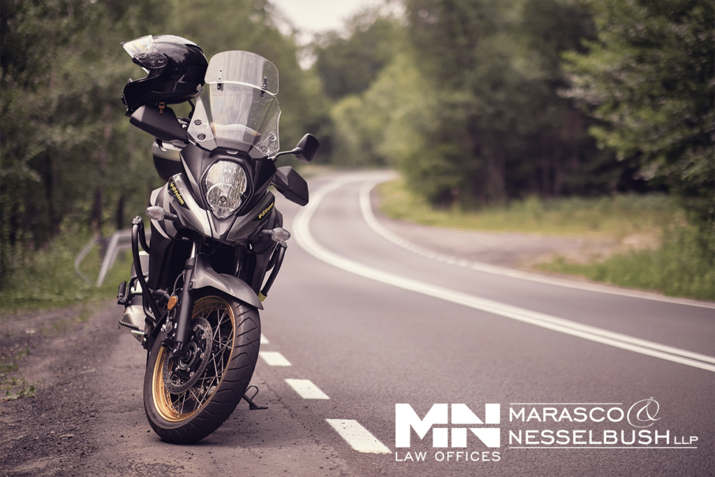 a motorcycle parked on the side of a road