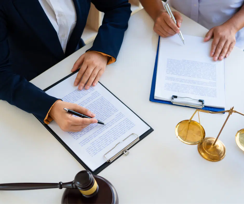 an attorney discussing legal documents with a client