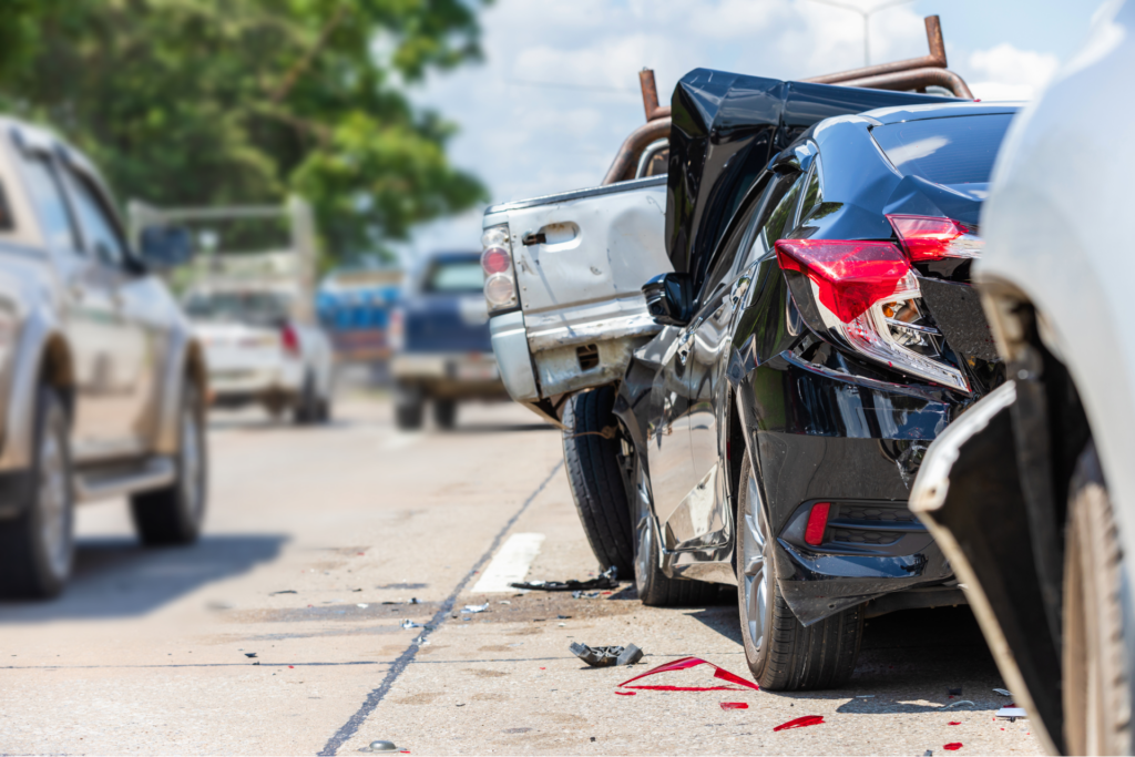 A car crash scene with a damaged vehicle