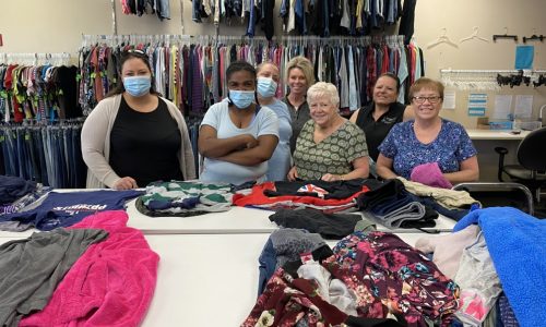 a group of women at charity drive for clothing for kids