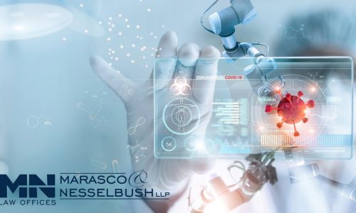 A doctor holding up a digital screen in their hands