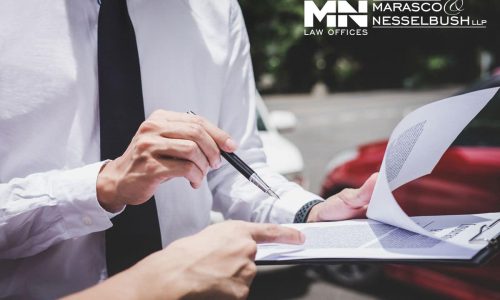 two people reviewing insurance documents