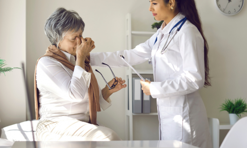 a doctor talking to a patient with vision problems