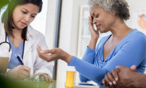 a doctor talking to the victim of an amputation accident