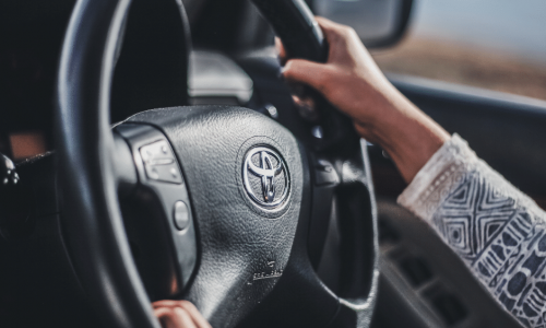 a woman driving a car in rhode island