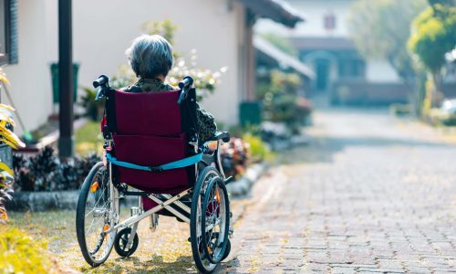 senior sitting on a wheel chair